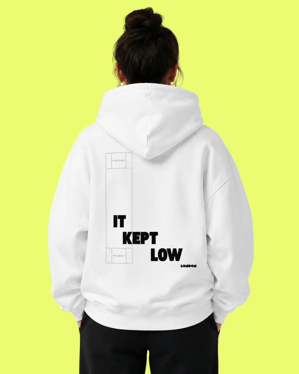 Person wearing a white hoodie with text on the back against a light gray background