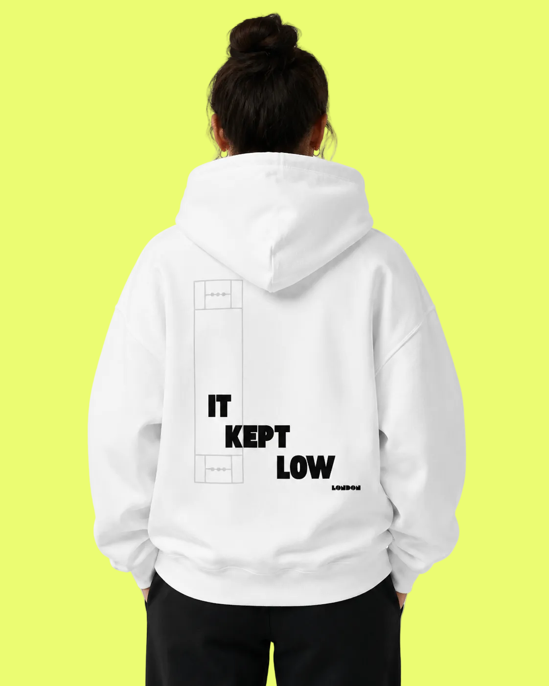 Person wearing a white hoodie with text on the back against a light gray background