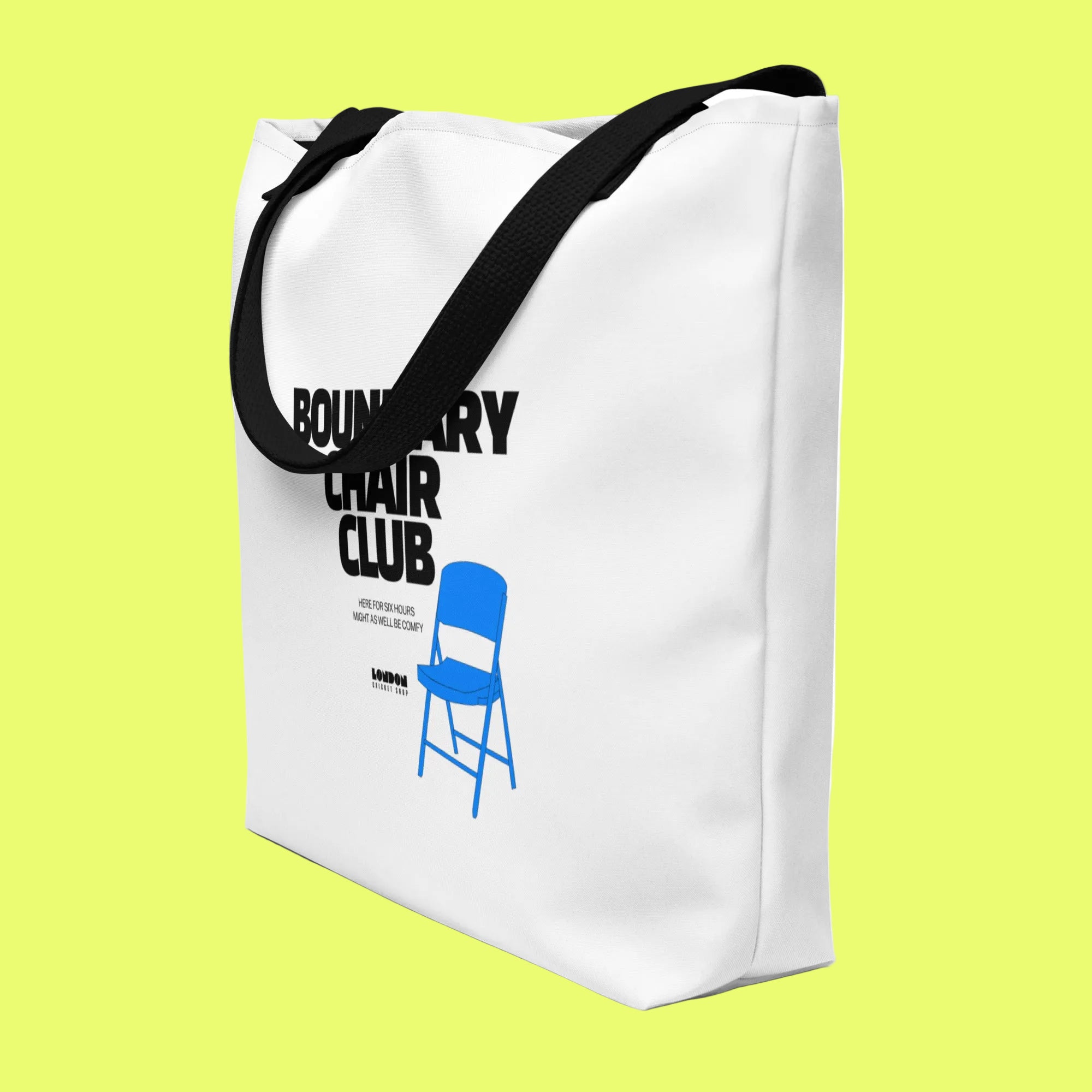 White tote bag with black text and a blue chair graphic on a white background