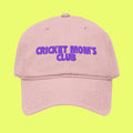Pink cap with 'CRICKET MOM'S CLUB' text in purple on a white background