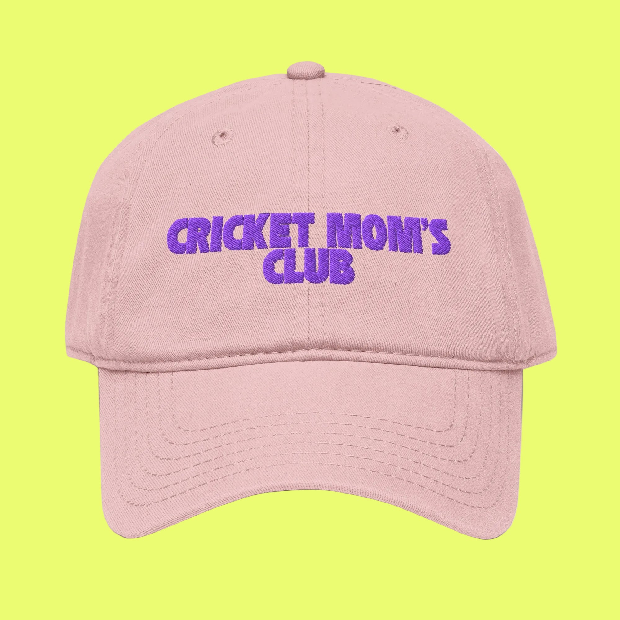 Pink cap with 'CRICKET MOM'S CLUB' text in purple on a white background
