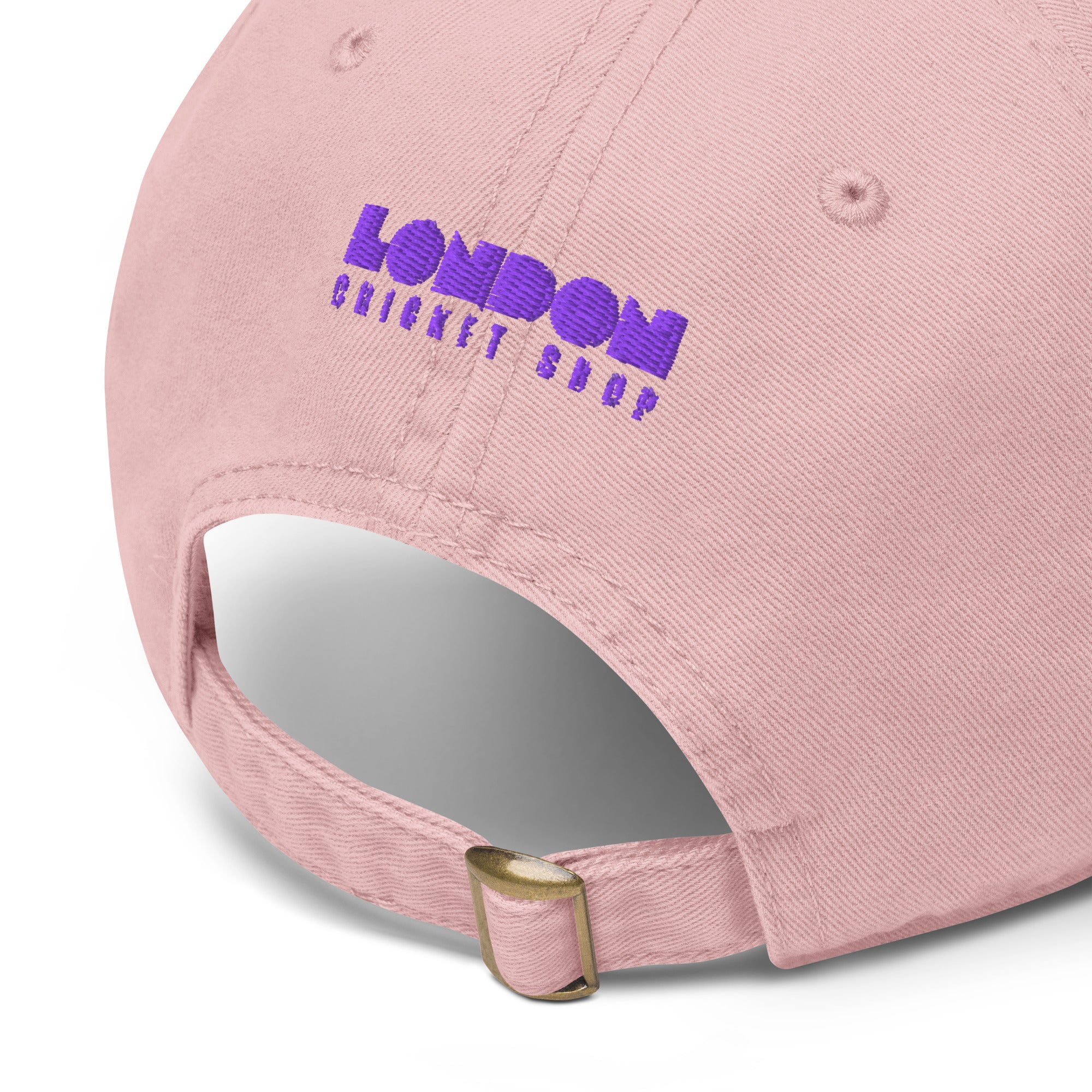 Pink cap with 'London Cricket Shop' embroidered on a white background